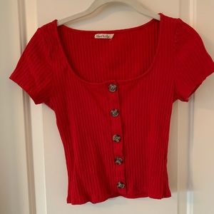Red crop top with buttons on the front